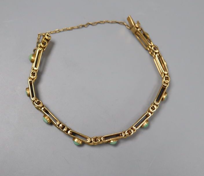 An Edwardian 9ct and nine stone turquoise set gatelink bracelet, approx. 17.5cm,